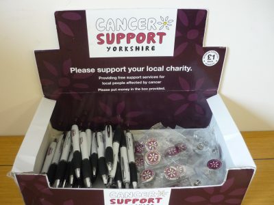 Cancer Support Yorkshire Merchandise Box containing pens and badges